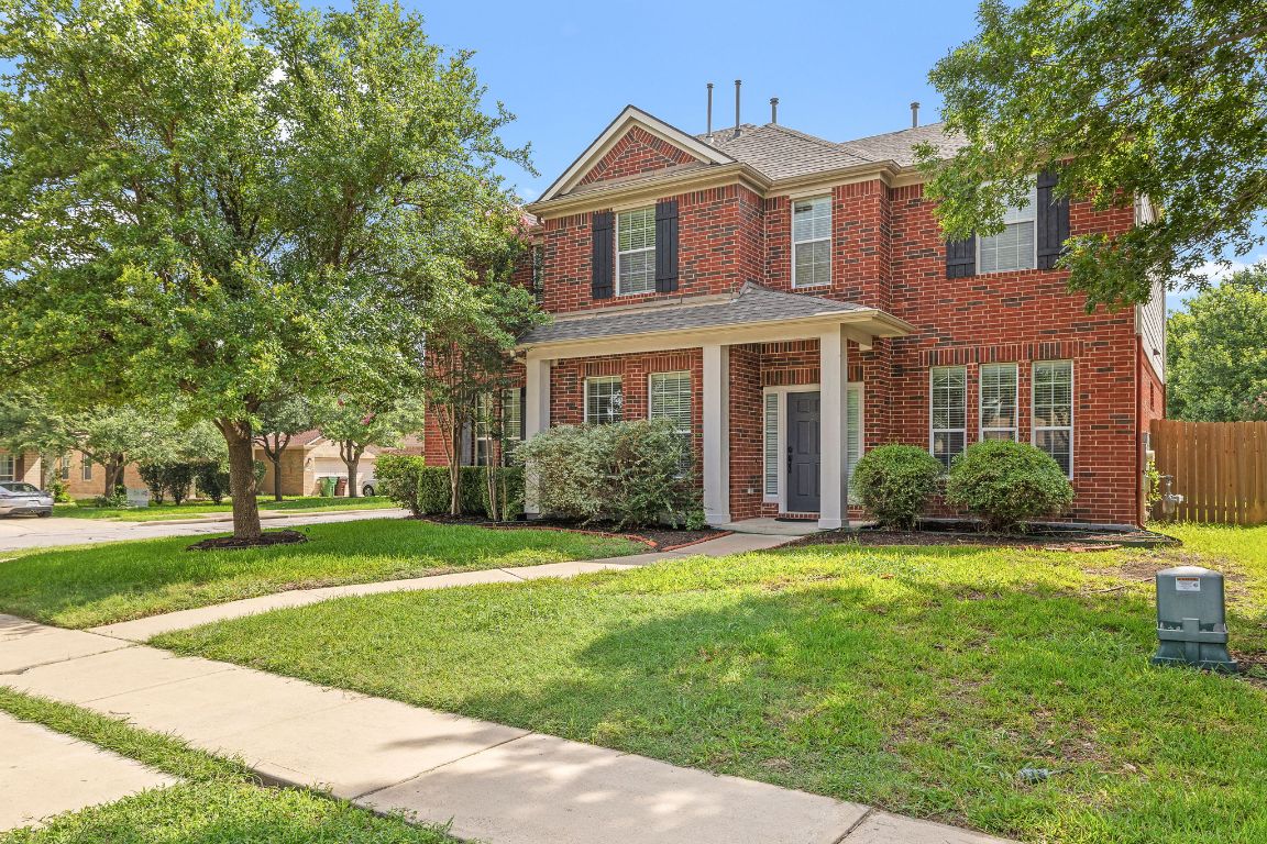 676 Rusk Road Round Rock, TX 78665 - Photo 3 of 35 A beautiful traditional home featuring brick siding and covered front porch