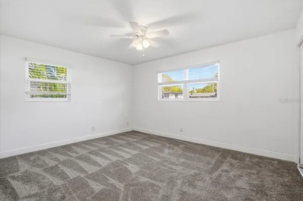 a view of an empty room and a window
