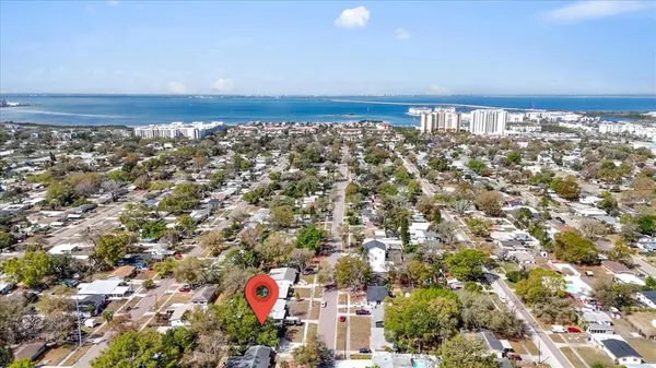 an aerial view of city and ocean