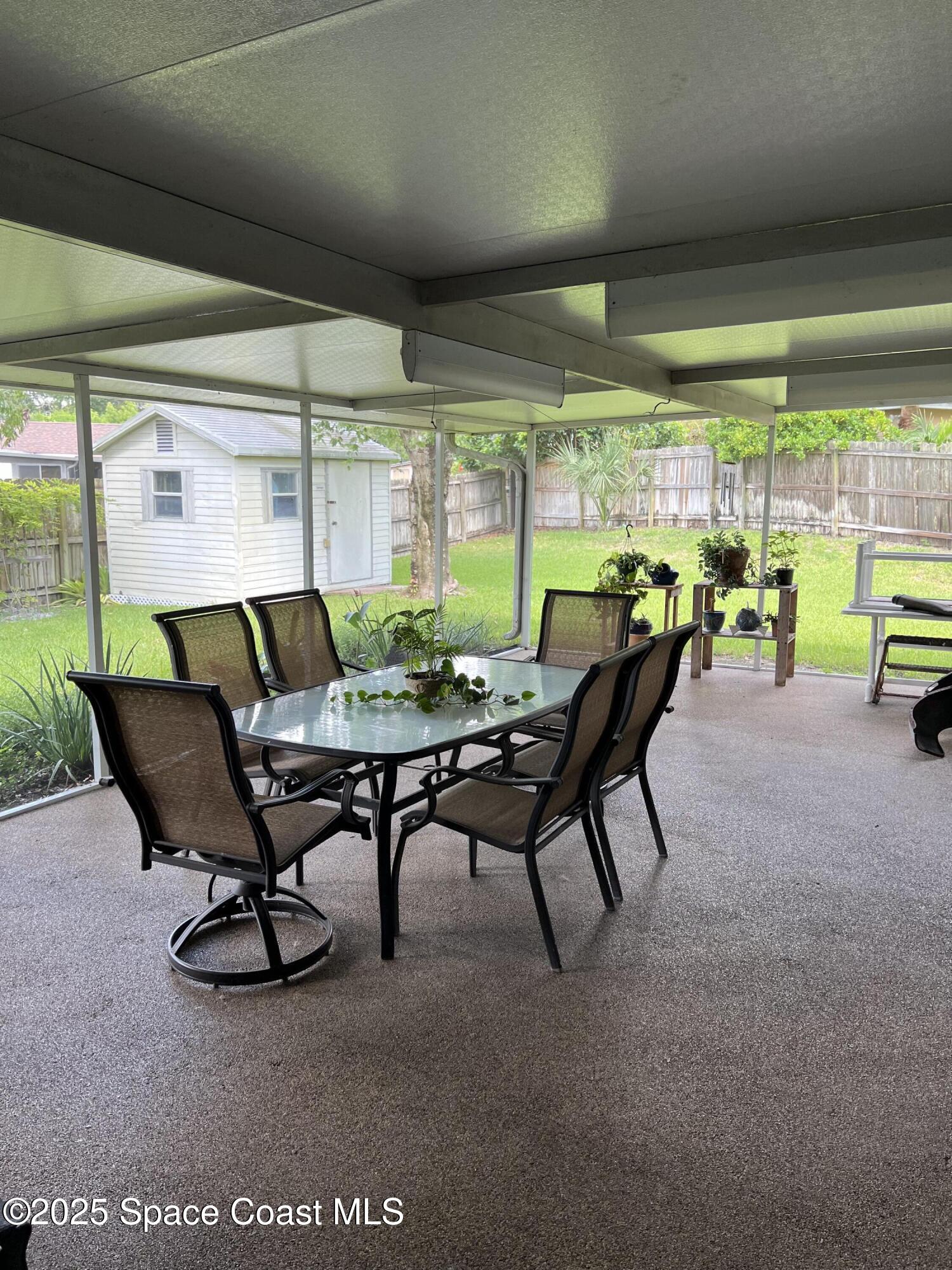 821 Hanover Court Rockledge, FL 32955 - Photo 12 of 15 a view of a dining room with furniture window and outside view