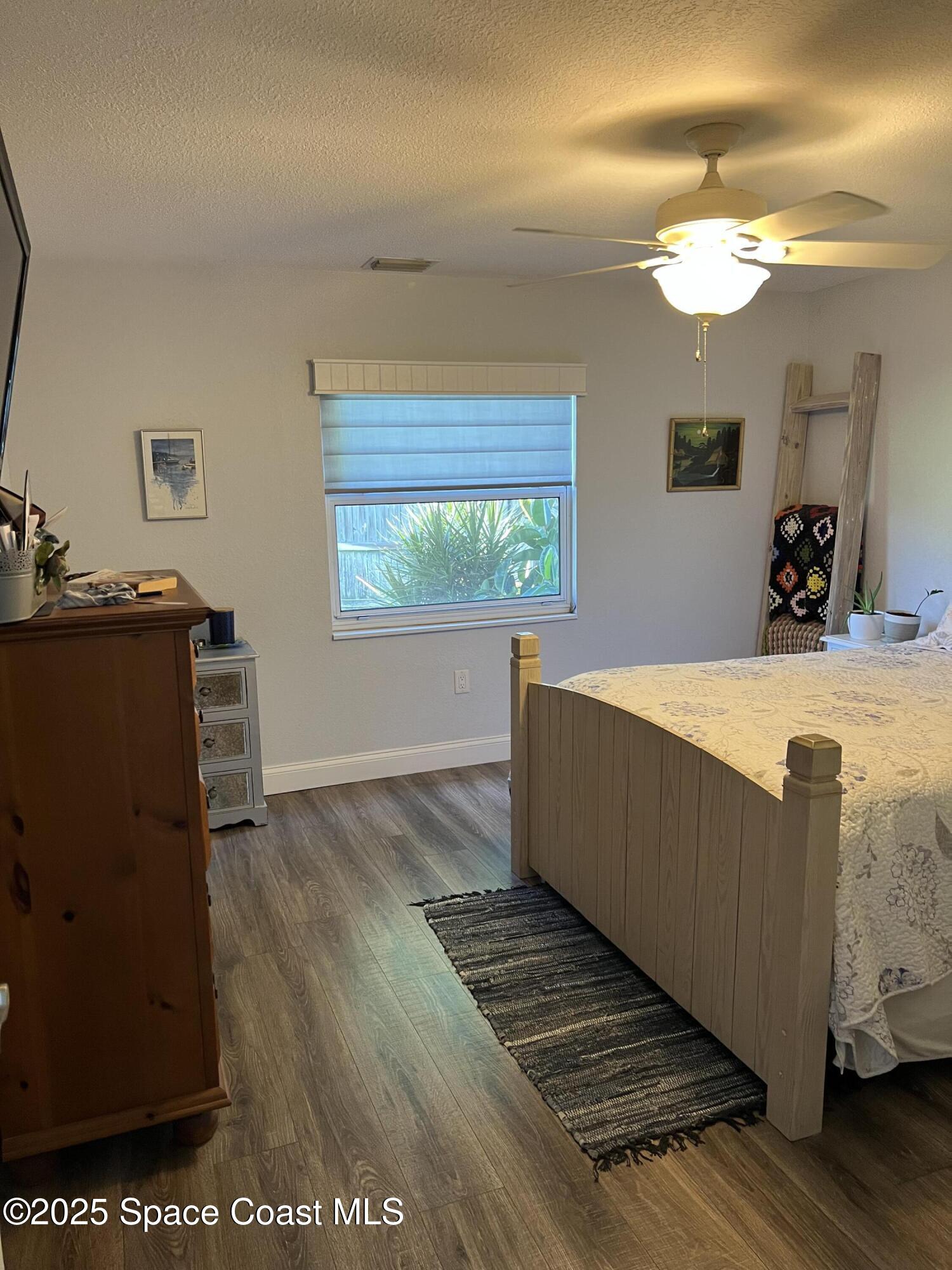 821 Hanover Court Rockledge, FL 32955 - Photo 6 of 15 a living room with furniture and a fireplace
