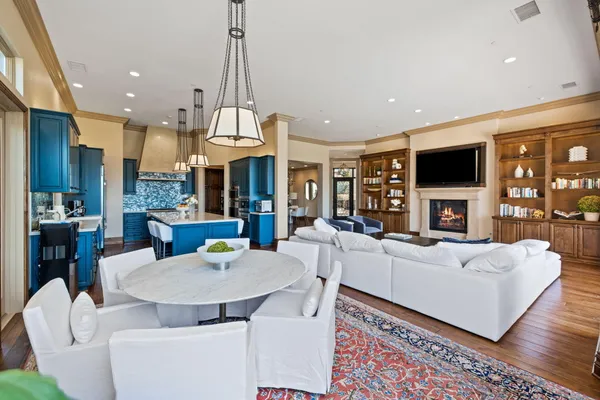 a living room with fireplace furniture and a flat screen tv