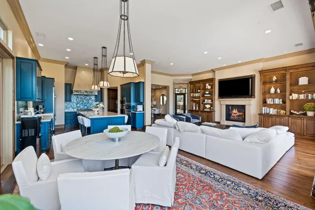 a living room with fireplace furniture and a flat screen tv