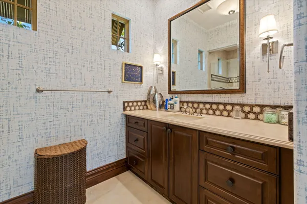 a view of a patio with couches chairs and a potted plant