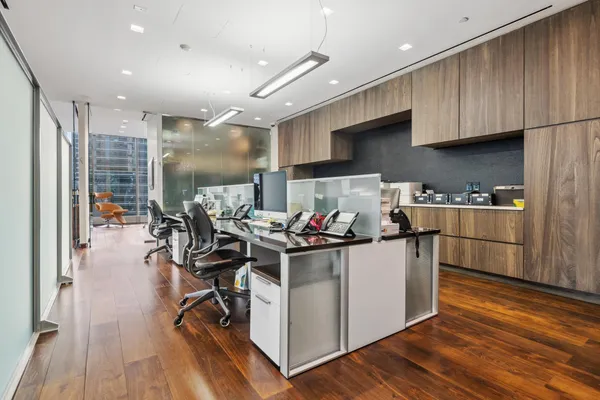 a kitchen with stainless steel appliances a lot of counter space