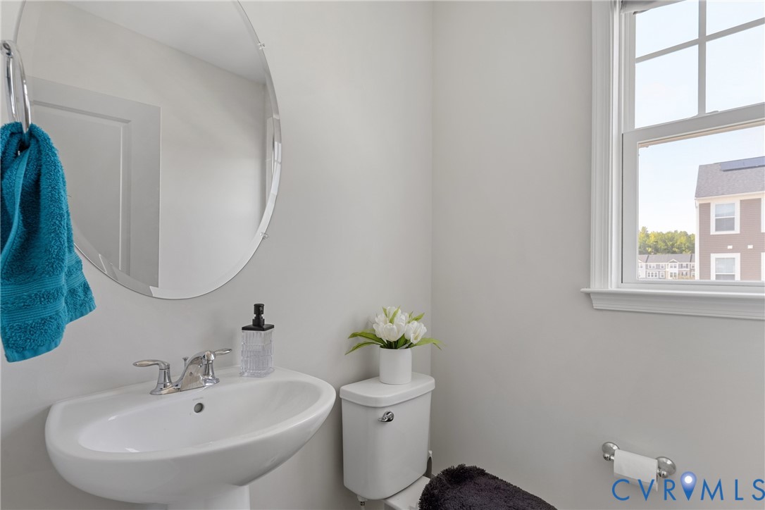 640 Rivanna Hill Road Glen Allen, VA 23060 - Photo 22 of 37 Bright bathroom featuring a curved vanity sink wit