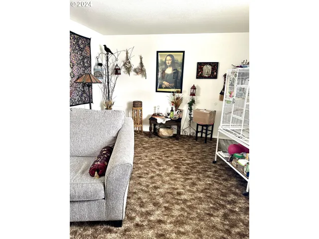 a living room with furniture and a rug