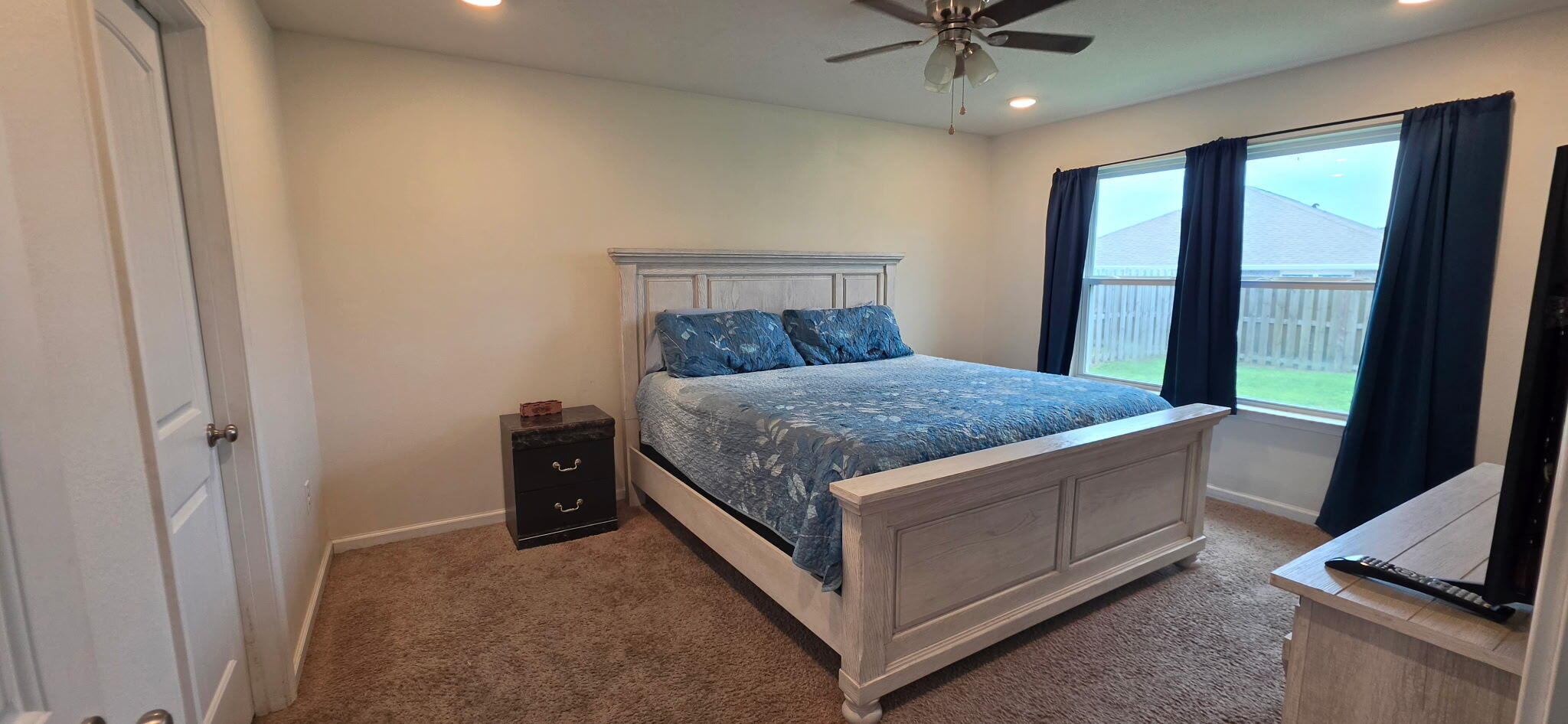 809 Moorhen Way Crestview, FL 32539 - Photo 14 of 24 a bedroom with a bed and a flat screen tv