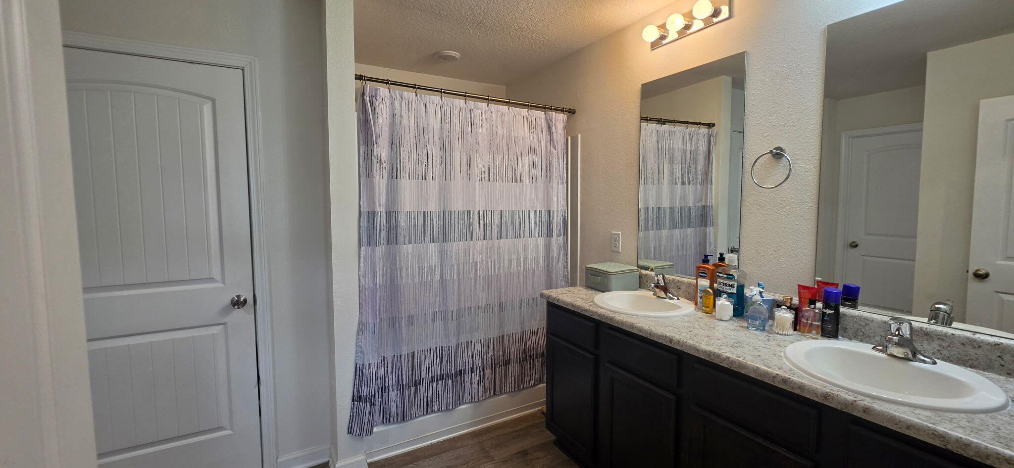 809 Moorhen Way Crestview, FL 32539 - Photo 15 of 24 a bathroom with double vanity sinks and a mirror