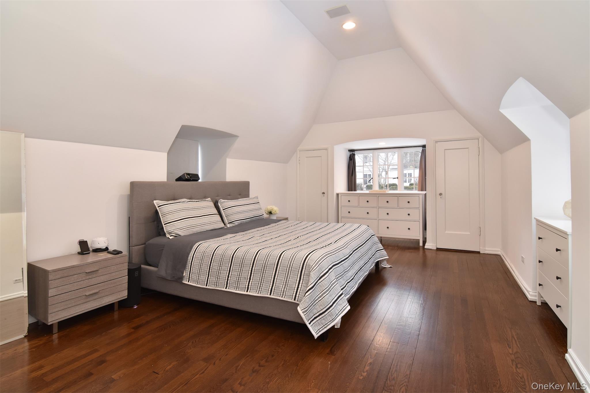 30 Locust Lane Bronxville, NY 10708 - Photo 14 of 28 a bedroom with a bed and wooden floor