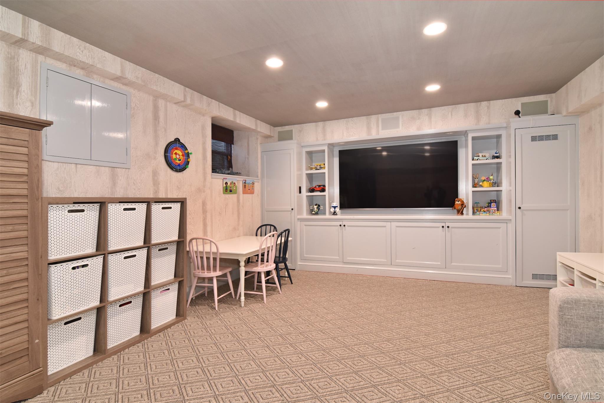 30 Locust Lane Bronxville, NY 10708 - Photo 20 of 28 a living room with stainless steel appliances furniture and a flat screen tv