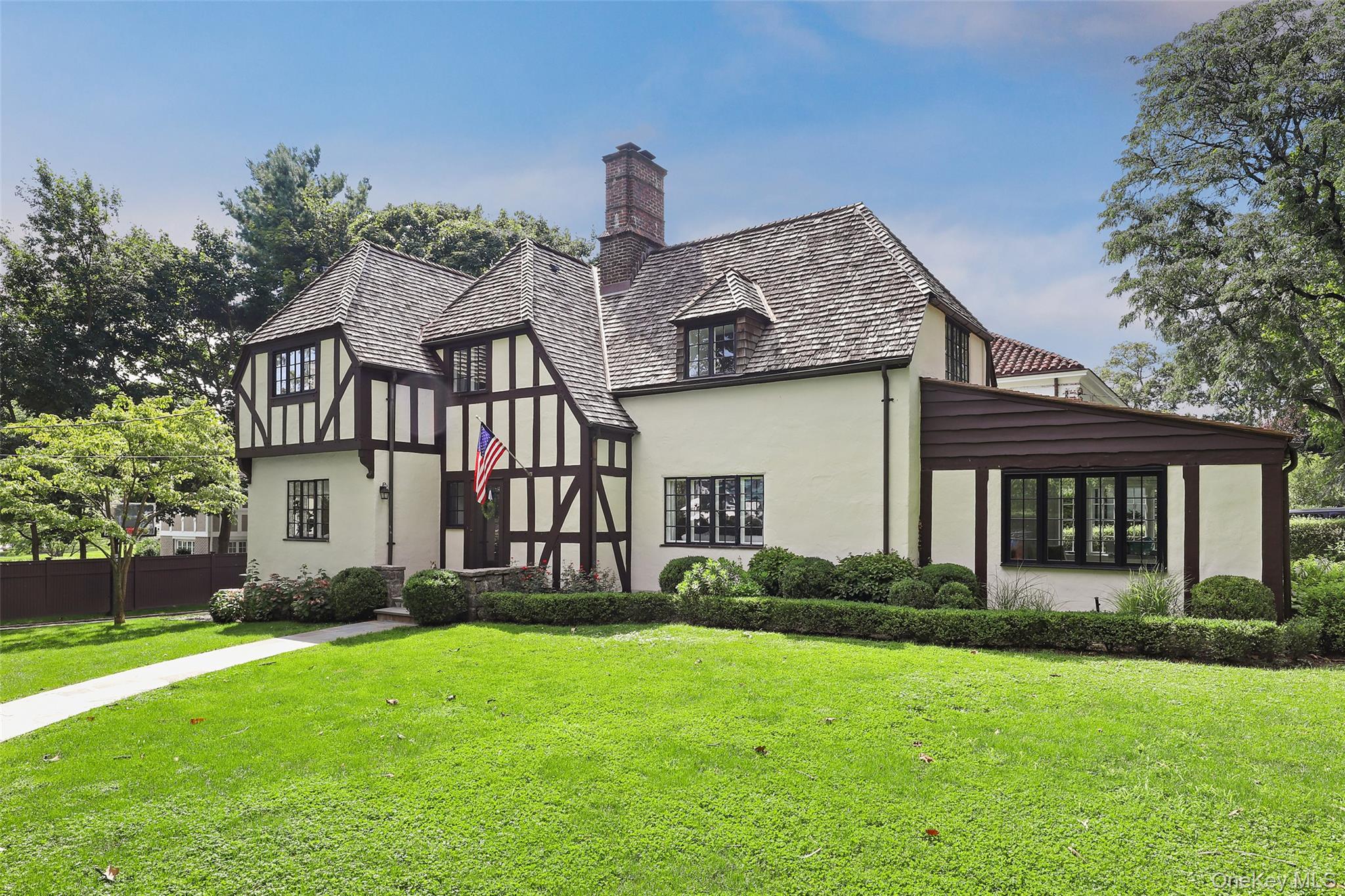 30 Locust Lane Bronxville, NY 10708 - Photo 2 of 28 a front view of a house with a yard