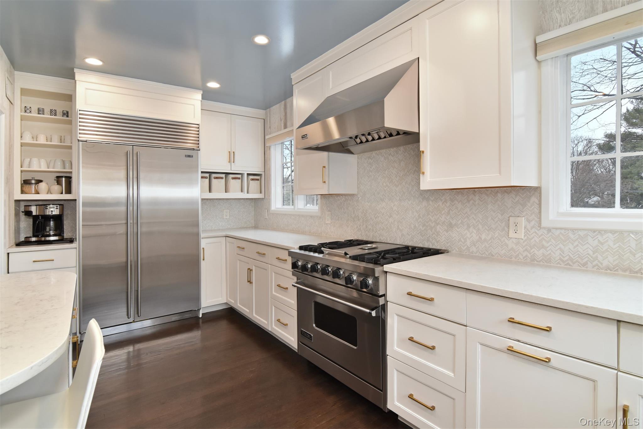 30 Locust Lane Bronxville, NY 10708 - Photo 8 of 28 a kitchen with stainless steel appliances granite countertop a stove and a refrigerator