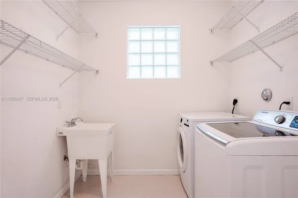 a utility room with dryer and washer