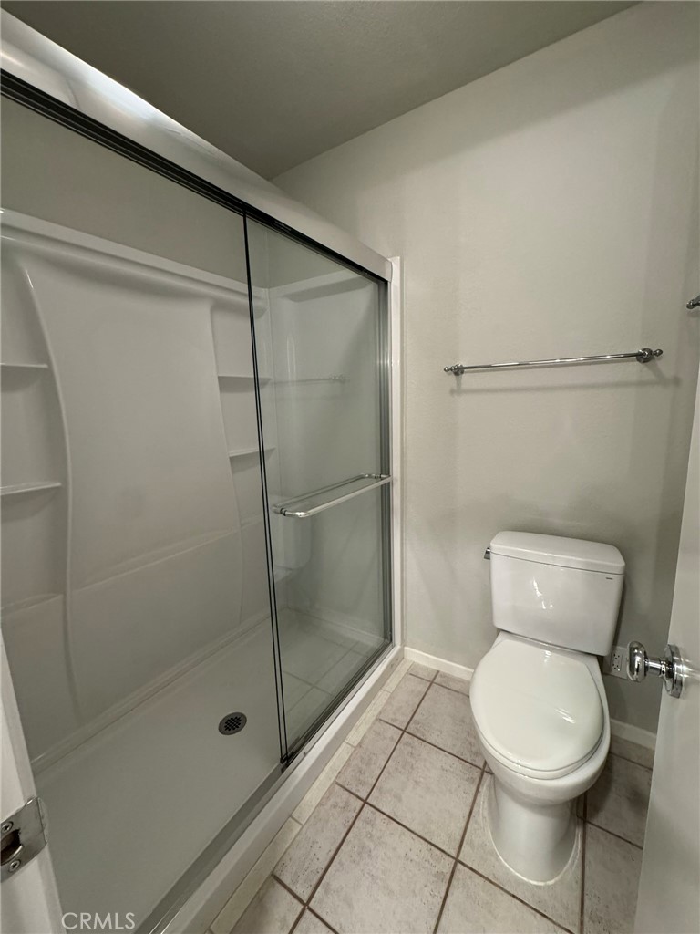 1254 Sand Creek Road San Dimas, CA 91773 - Photo 17 of 26 a bathroom with a toilet and a shower