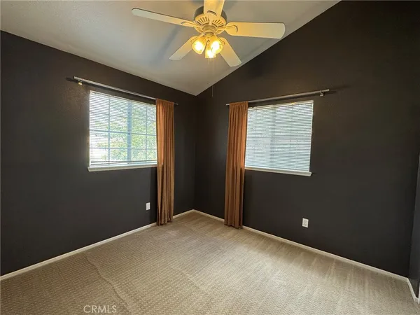 a bedroom with bed and window
