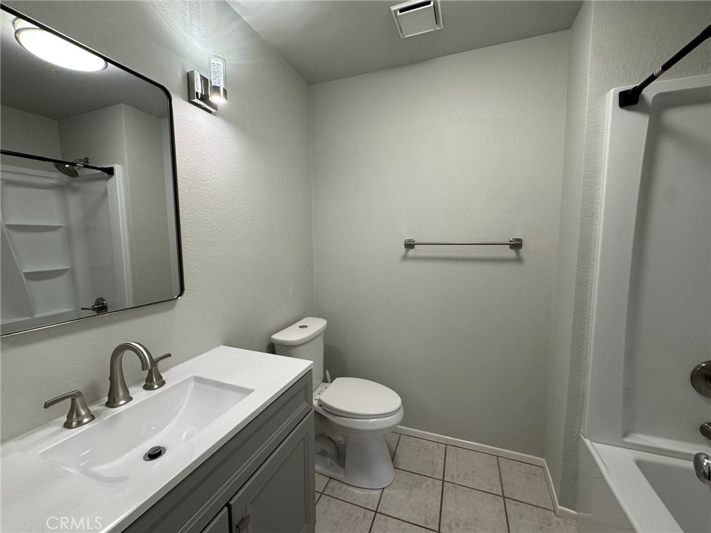 1254 Sand Creek Road San Dimas, CA 91773 - Photo 22 of 26 a bathroom with a sink toilet and shower