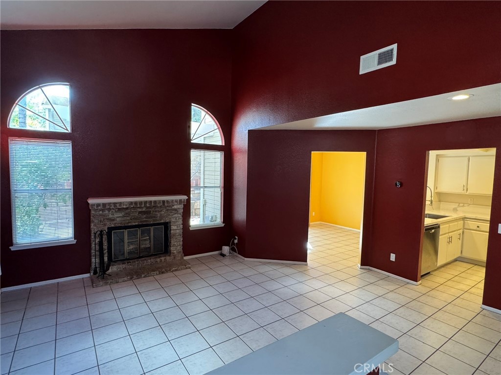 1254 Sand Creek Road San Dimas, CA 91773 - Photo 3 of 26 a view of an empty room with a fireplace and a window