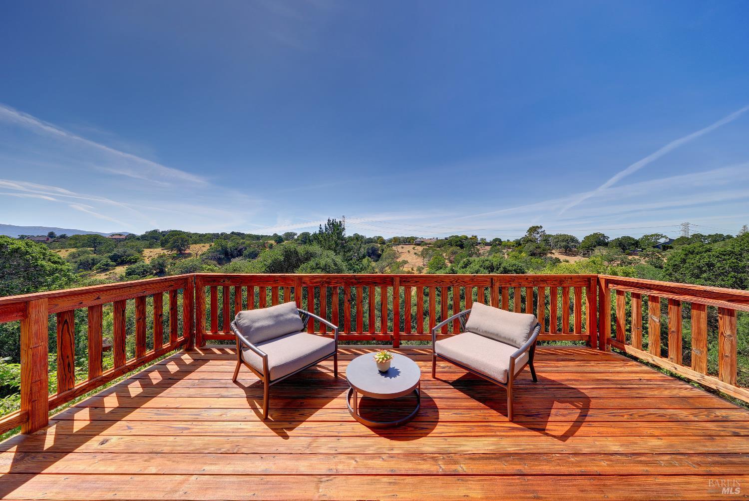 10 Lockton Lane Novato, CA 94945 - Photo 27 of 68 Private deck off the primary suite with expansive views, ideal for morning coffee, quiet reading, or relaxing in the sun.