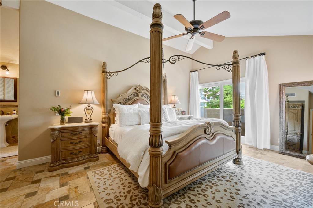 28111 Via Rueda San Juan Capistrano, CA 92675 - Photo 11 of 30 a bed room with a bed and a chandelier