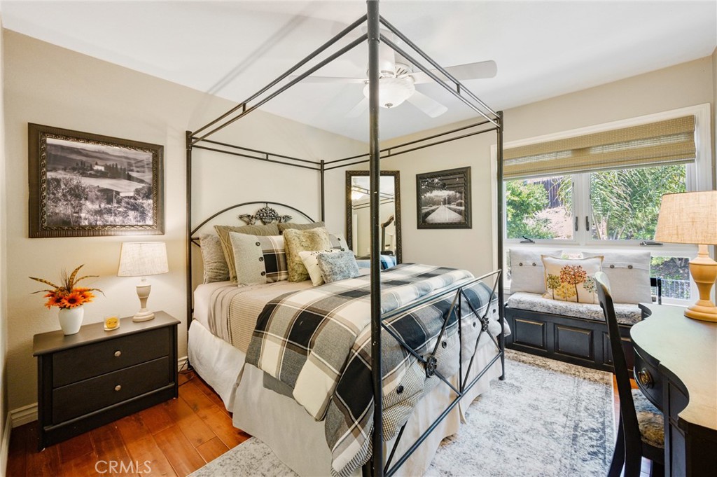 28111 Via Rueda San Juan Capistrano, CA 92675 - Photo 16 of 30 a bedroom with a bed couch and window