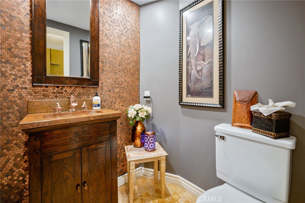 28111 Via Rueda San Juan Capistrano, CA 92675 - Photo 3 of 30 a bathroom with a sink and a mirror