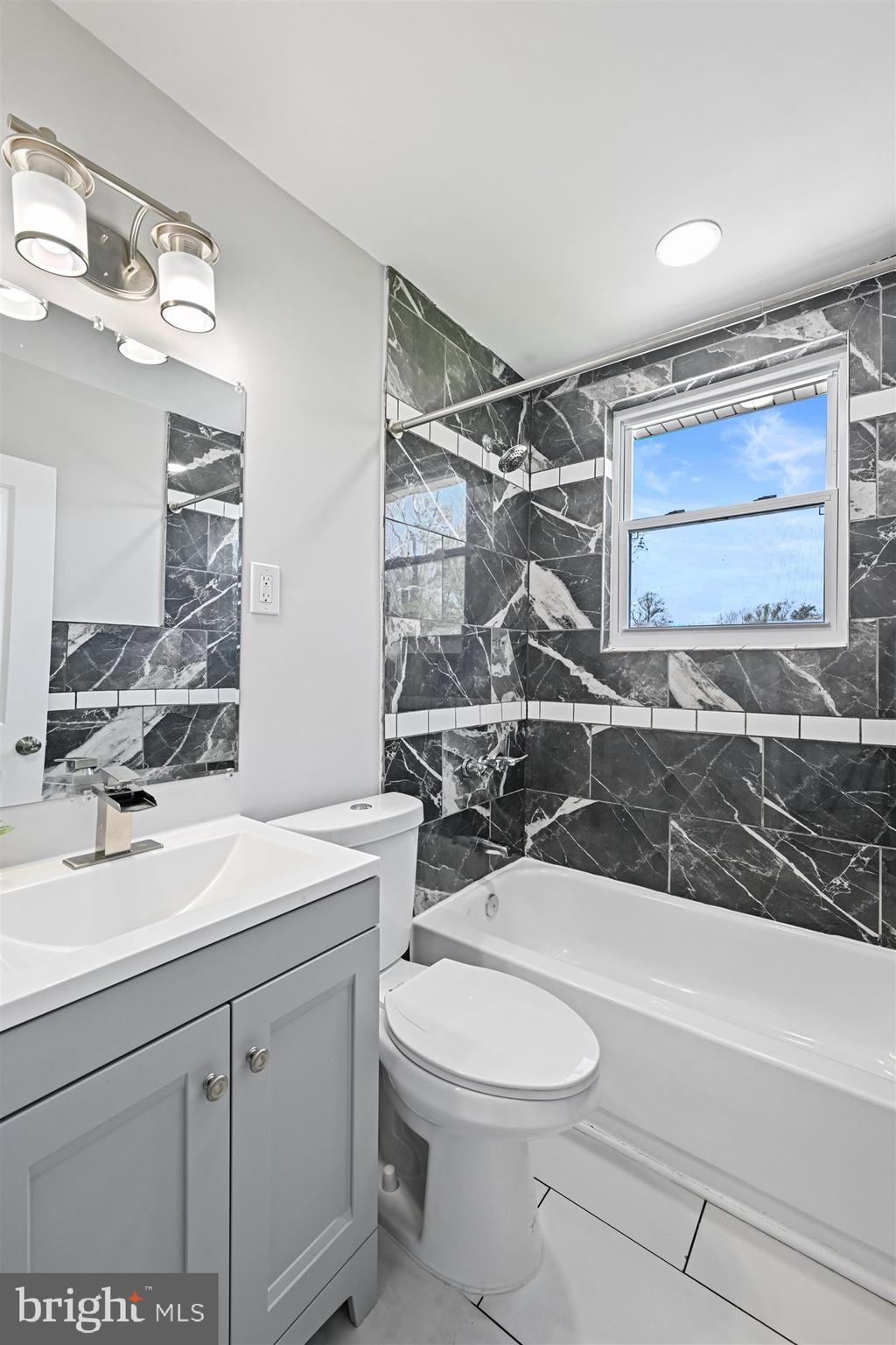 3536 Milford Mill Road Windsor Mill, MD 21244 - Photo 16 of 28 Tub shower and tile surround