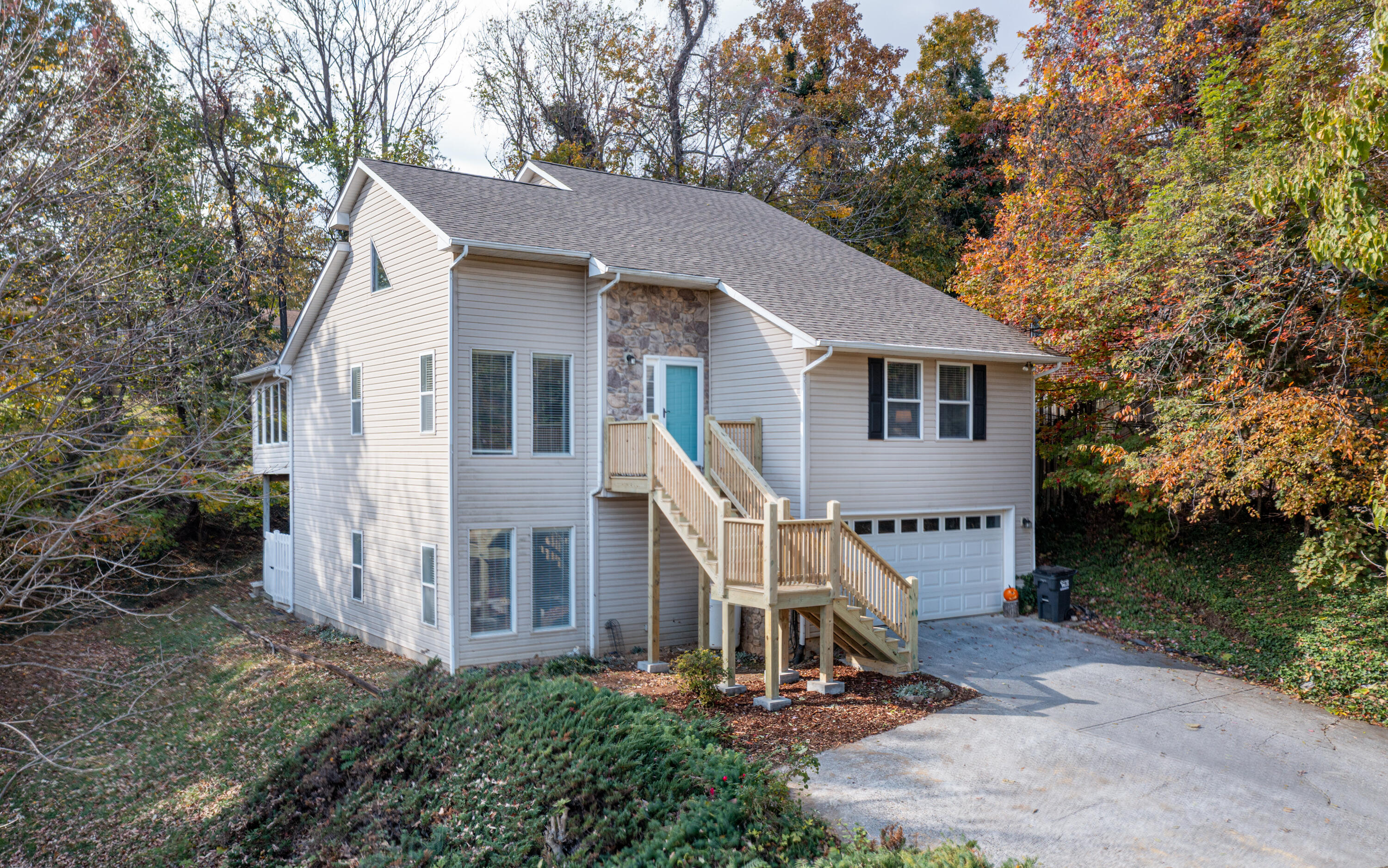 a view of a house with yard and sitting area