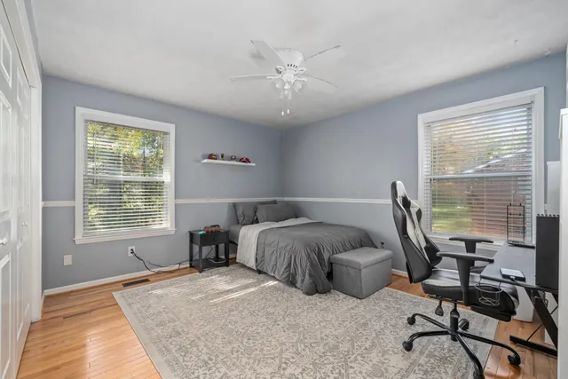 a bedroom with furniture and a window