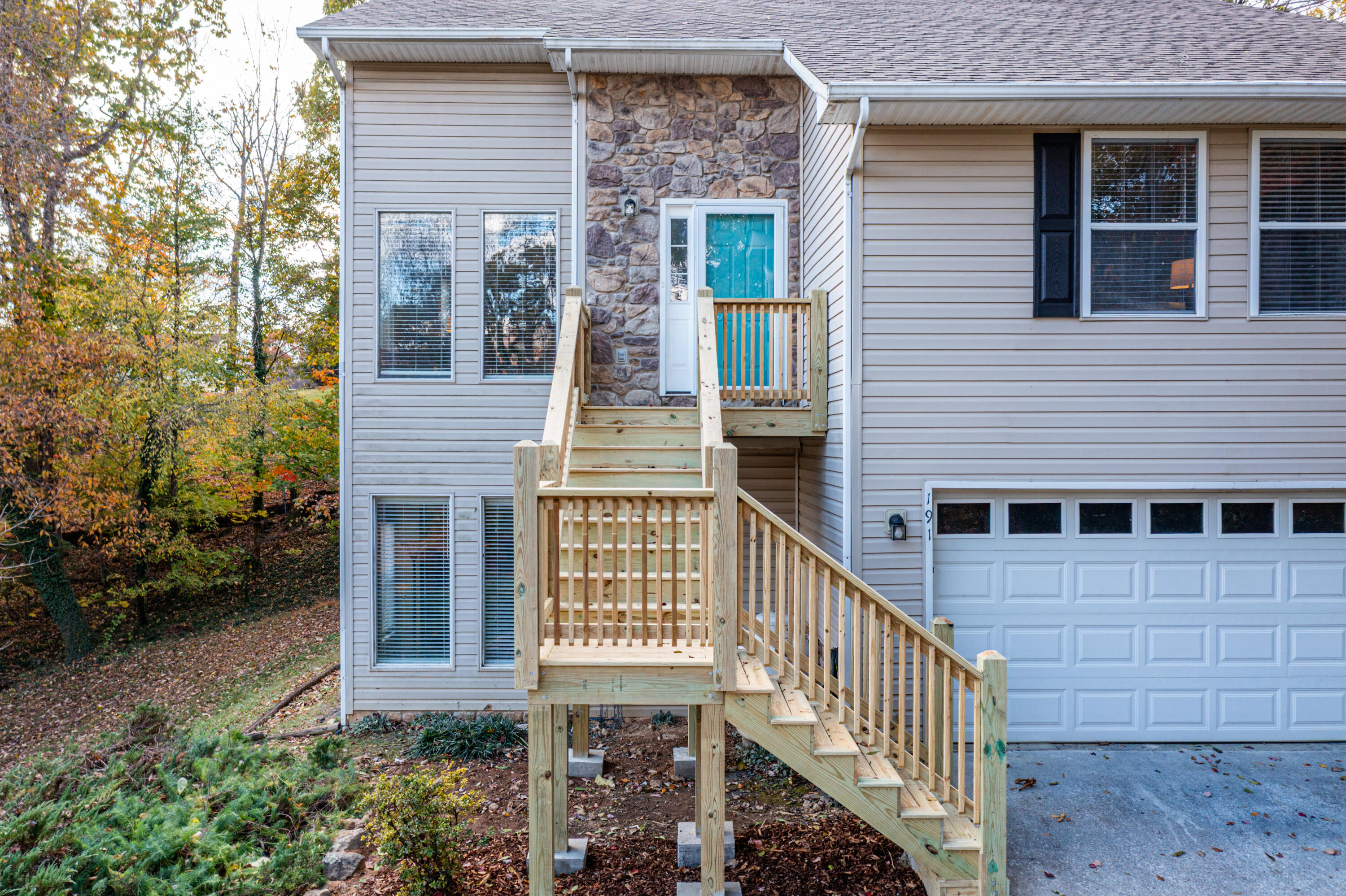 191 Pin Oak Drive Blue Ridge, VA 24064 - Photo 2 of 26 a view of a brick house with many windows