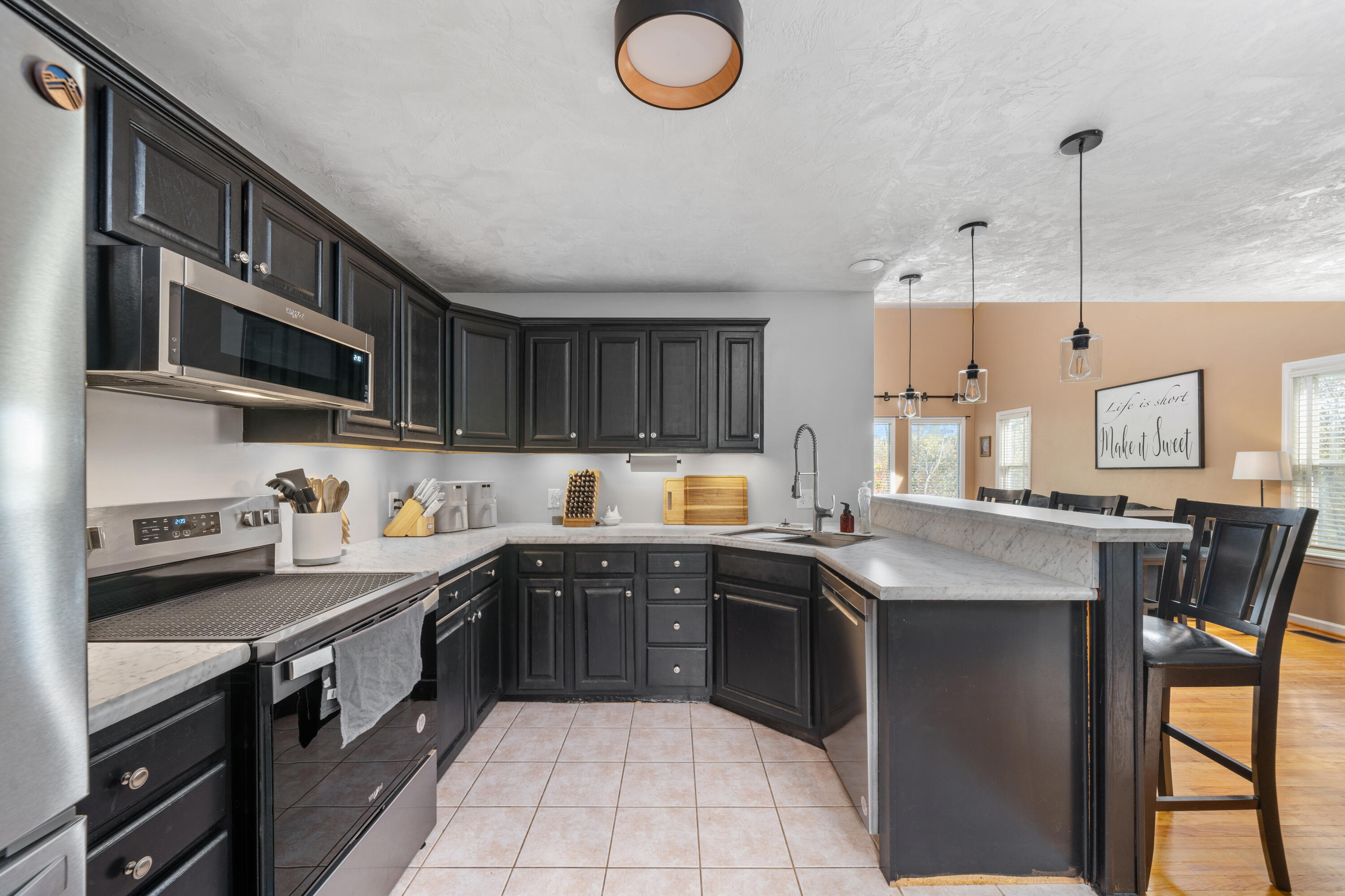 191 Pin Oak Drive Blue Ridge, VA 24064 - Photo 9 of 26 a kitchen with stainless steel appliances granite countertop a sink a stove and a microwave