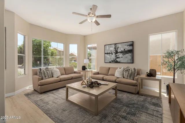 a kitchen with sink a microwave and refrigerator