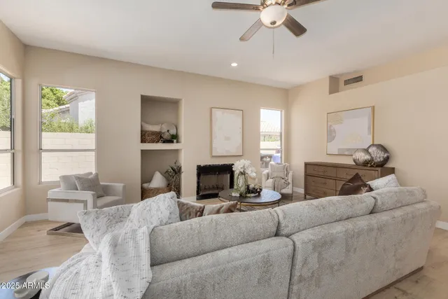 a bedroom with bed and wooden floor