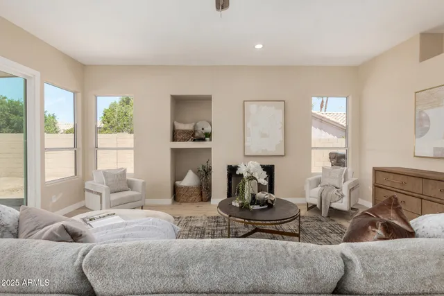 a spacious bedroom with a bed and cabinet
