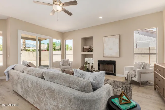 a spacious bathroom with a granite countertop sink and a mirror