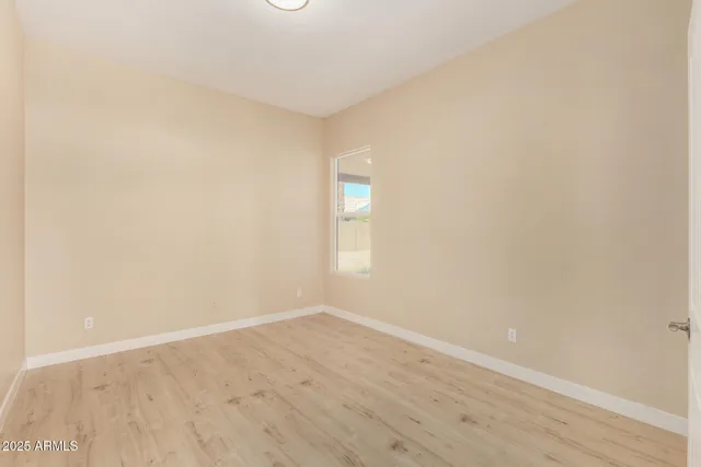 a bathroom with bathtub and window