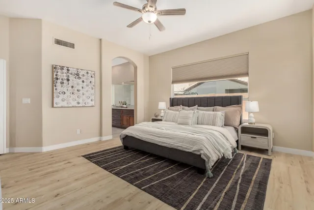 a street view with tall buildings and a yard