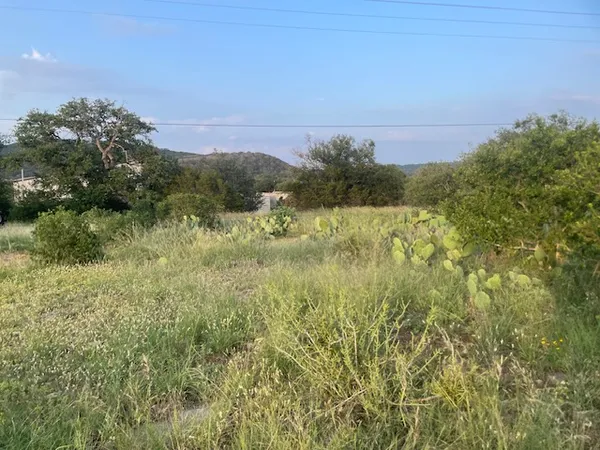 a view of lake with green space