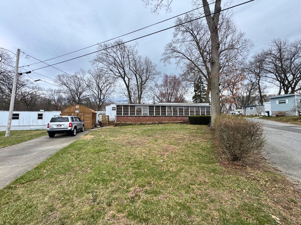 7 Oriole Drive Chicopee, MA 01020 - Photo 1 of 9 a view of a car parked in front of a house