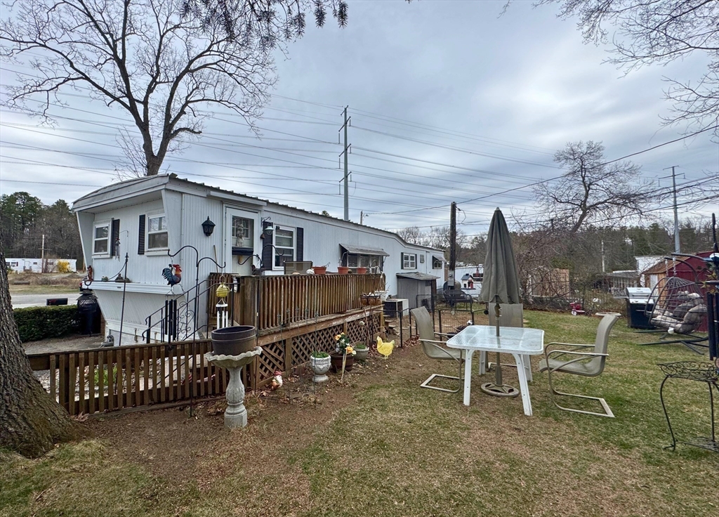 7 Oriole Drive Chicopee, MA 01020 - Photo 2 of 9 a view of a chair and tables in the roof deck