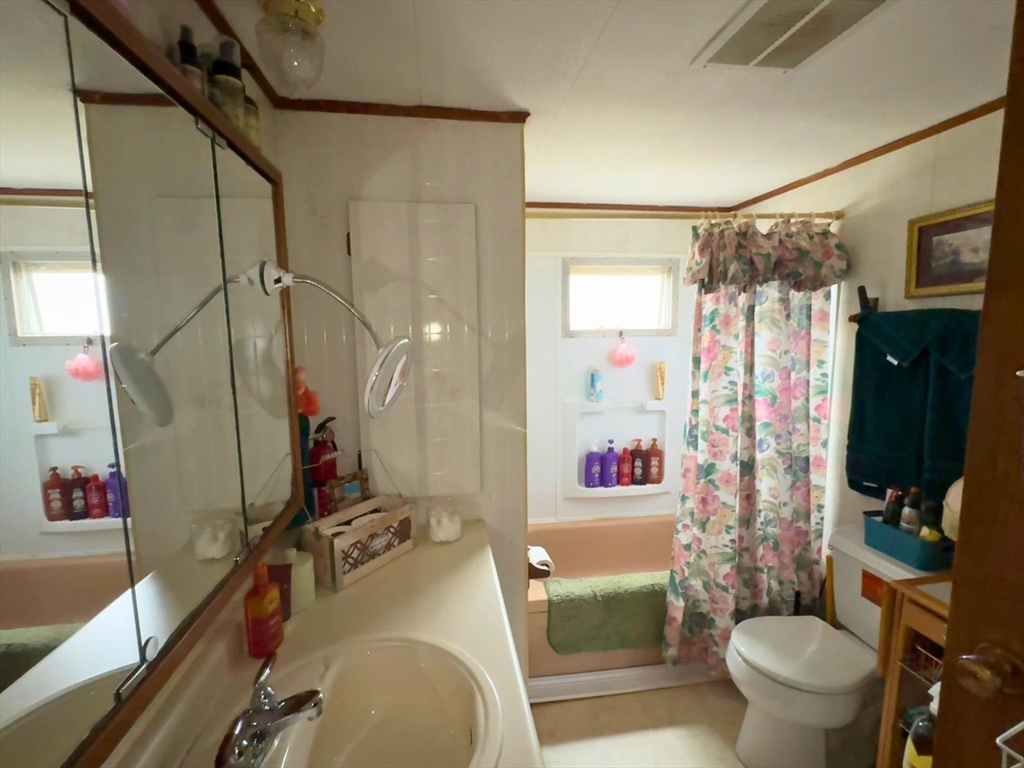 7 Oriole Drive Chicopee, MA 01020 - Photo 5 of 9 a bathroom with a sink toilet and shower