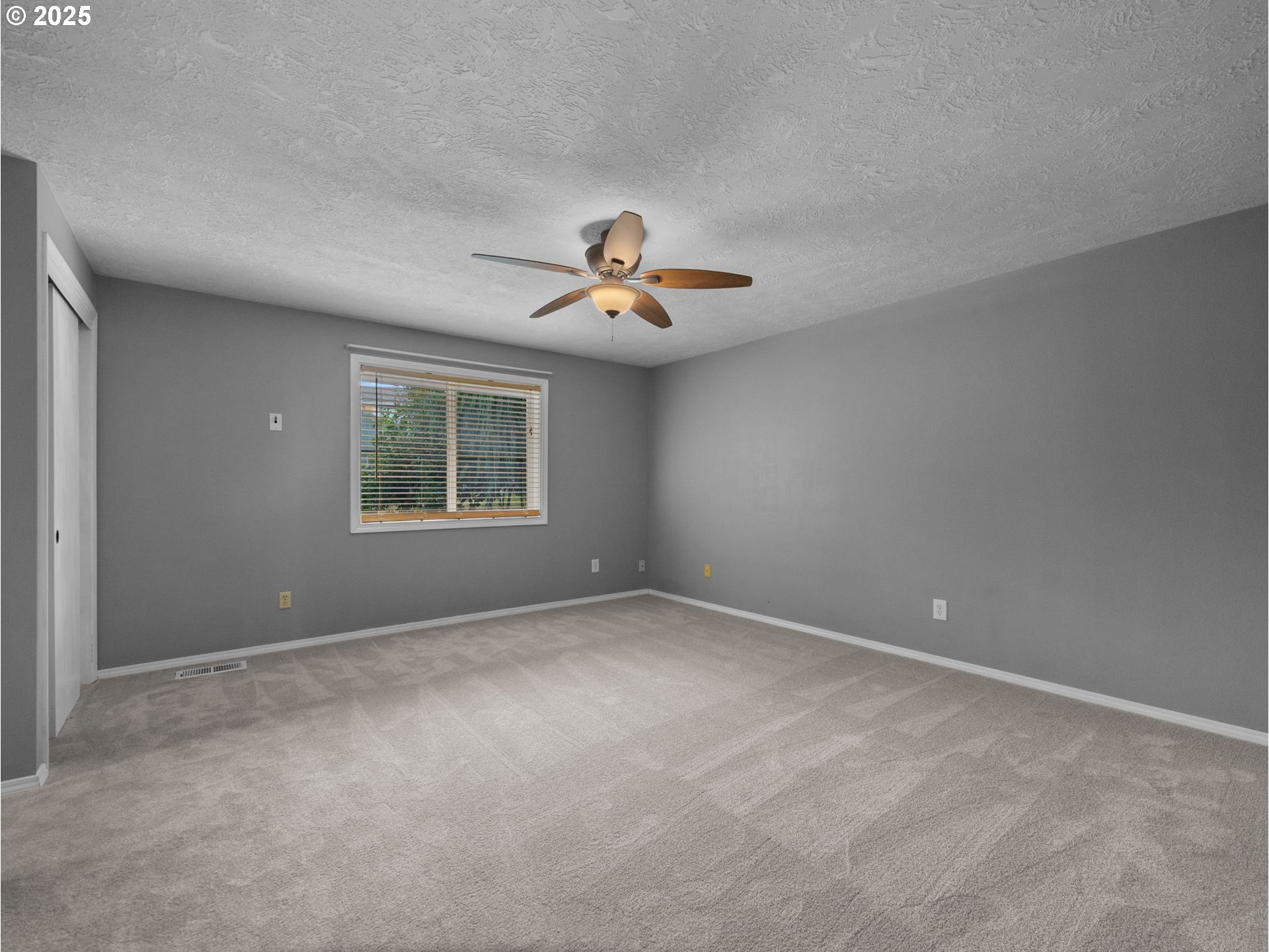 2510 Southwest Lillyben Court Gresham, OR 97080 - Photo 13 of 26 an empty room with ceiling fan and window