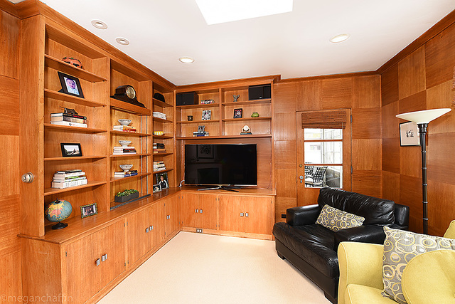 1004 Pontiac Road Wilmette, IL 60091 - Photo 11 of 28 a living room with furniture cabinets and a flat screen tv