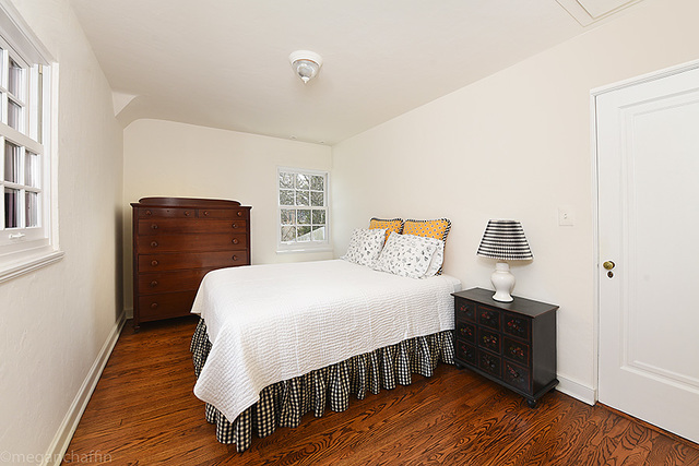1004 Pontiac Road Wilmette, IL 60091 - Photo 19 of 28 a bedroom with a bed and wooden floor