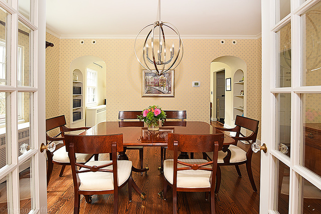 1004 Pontiac Road Wilmette, IL 60091 - Photo 6 of 28 a view of a dining room with furniture and wooden floor