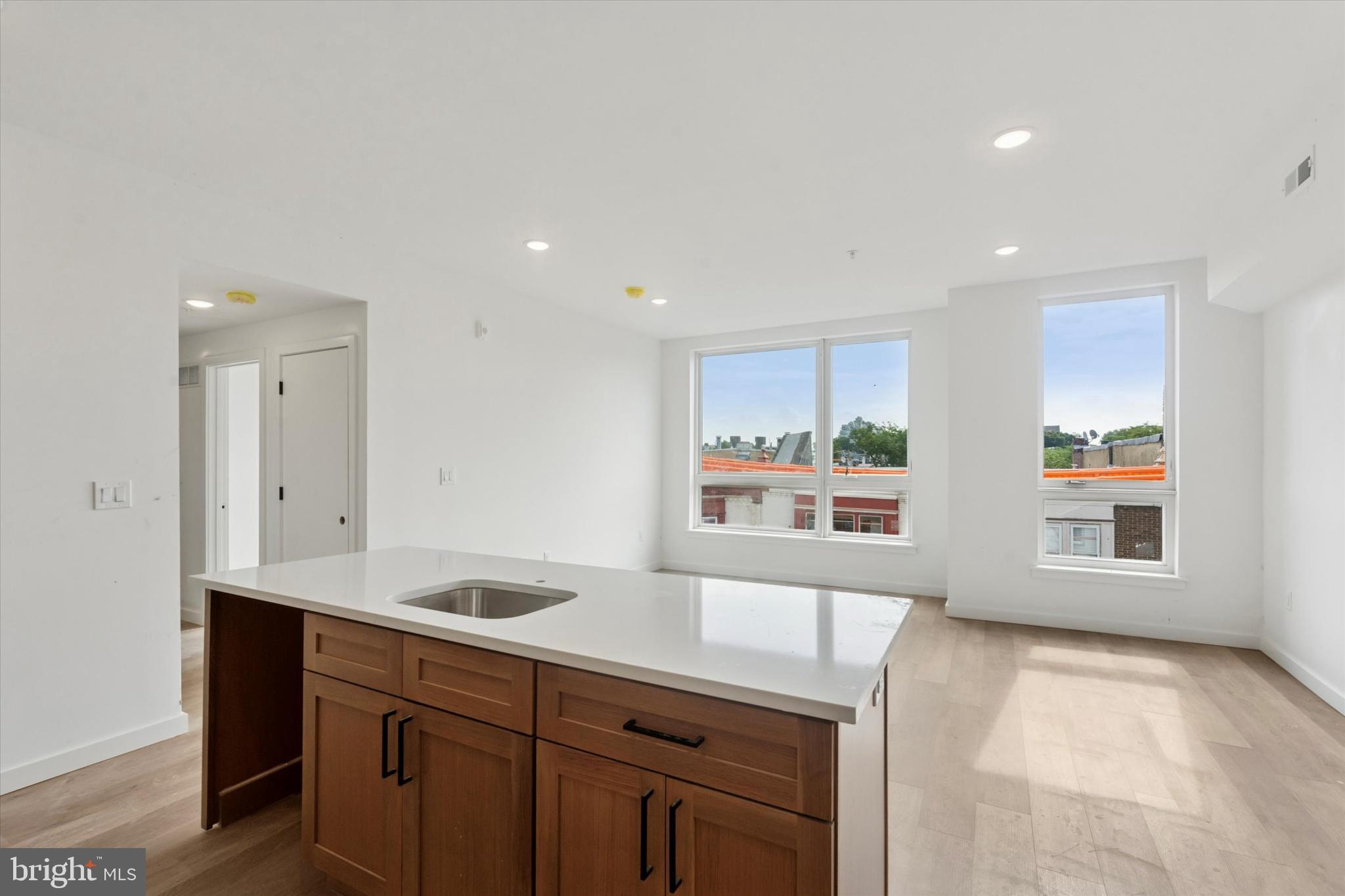 754 South 4th Street, Unit 401 Philadelphia, PA 19147 - Photo 3 of 18 a view of a kitchen with a sink and window