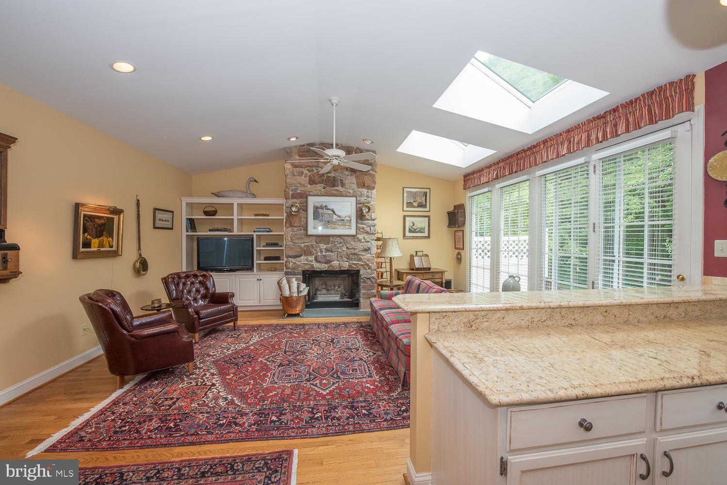 201 3 Rivers Court, Unit 101 Berwyn, PA 19312 - Photo 13 of 30 Gas stone fireplace with built-ins