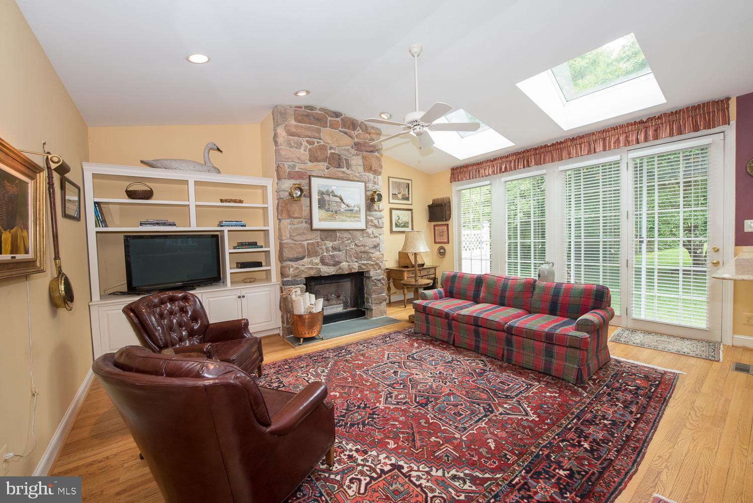 201 3 Rivers Court, Unit 101 Berwyn, PA 19312 - Photo 9 of 30 Family room with oversized french door to paito