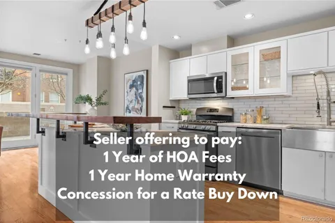 a kitchen with granite countertop a stove top oven a sink and cabinets