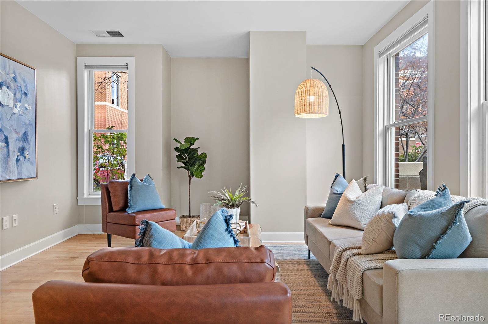 1630 North Clarkson Street, Unit 110 Denver, CO 80218 - Photo 28 of 36 a living room with furniture and a large window